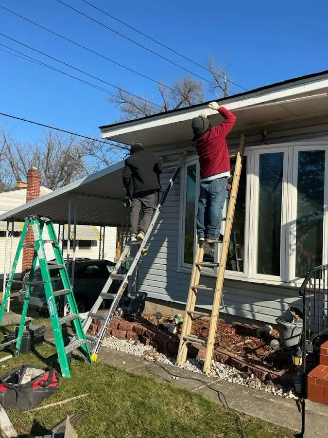 Restoration crew performing exterior repair in Burton